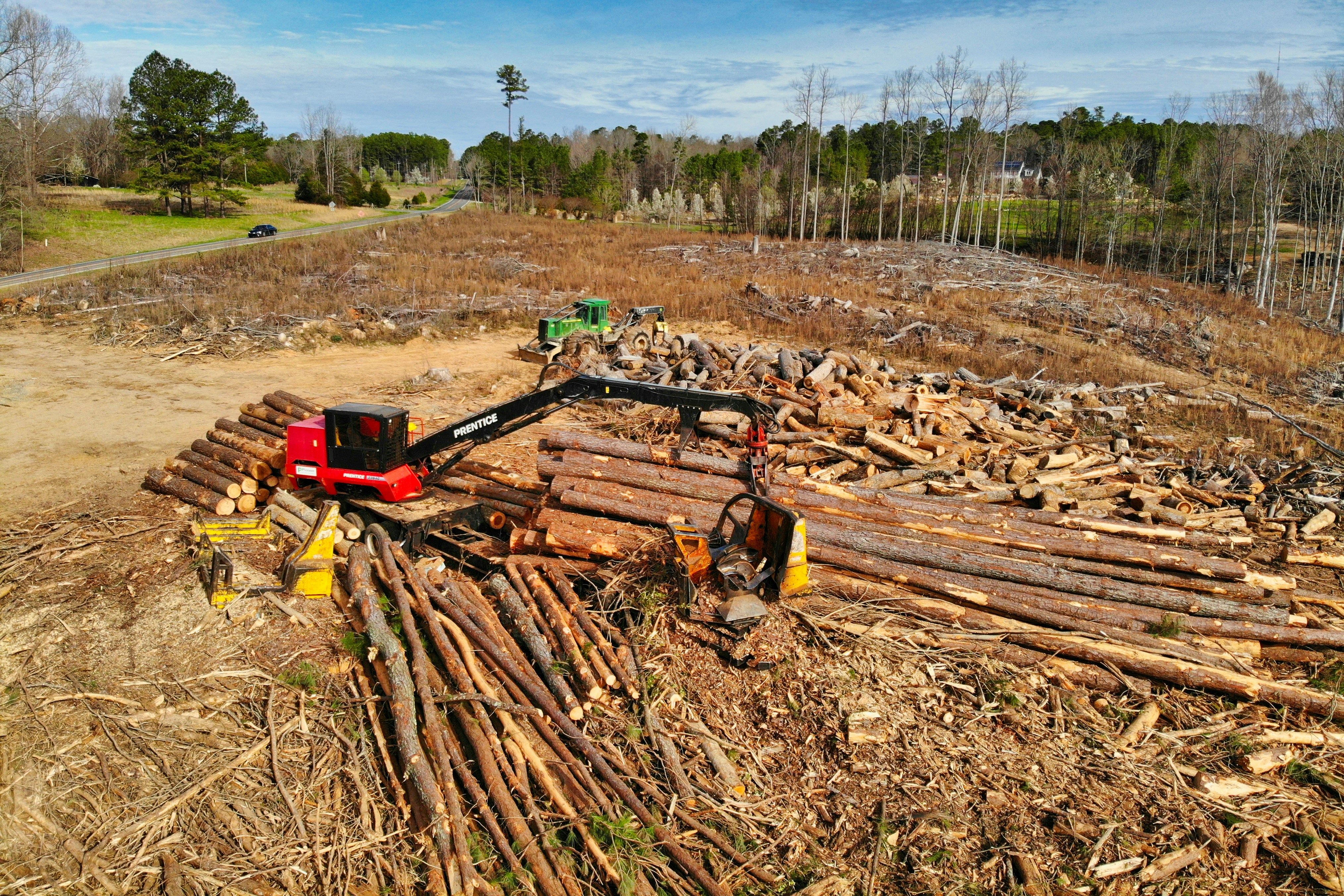 Heavy machinery clearing land of trees